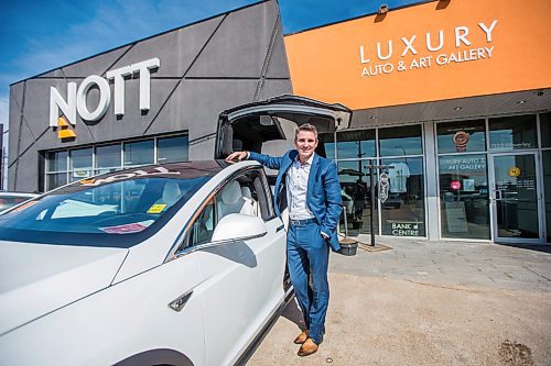 MIKAELA MACKENZIE / WINNIPEG FREE PRESS

Trevor Nott of Nott Auto poses with a Tesla at the car dealership in Winnipeg on Thursday, April 1, 2021. Nott has sold the first car in Manitoba using cryptocurrency (maybe the first in the country) and is about to do another. For Martin Cash story.

Winnipeg Free Press 2021