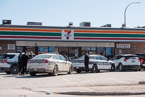 MIKE SUDOMA / WINNIPEG FREE PRESS 
WPS cruisers and officers outside of a 7-11 store on the corner of Arlington and Notre Dame Ave Thursday morning
April 1, 2021