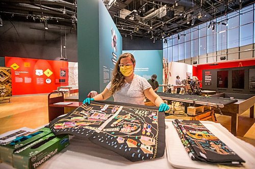 MIKAELA MACKENZIE / WINNIPEG FREE PRESS

Conservation technician Stephanie Chipilski unfolds pieces from the Intuthuko Embroidery Project in the new Artivism exhibit at the Canadian Museum for Human Rights in Winnipeg on Thursday, April 1, 2021. This South African embroidery group uses stitching to share stories of life during apartheid. Standup.

Winnipeg Free Press 2021