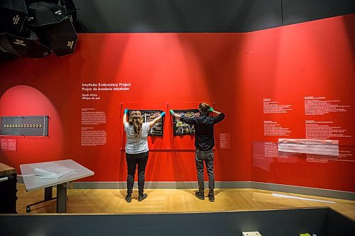 MIKAELA MACKENZIE / WINNIPEG FREE PRESS

Conservation technician Stephanie Chipilski (left) and another installer hold up pieces from the Intuthuko Embroidery Project to check for scale and placement in the new Artivism exhibit at the Canadian Museum for Human Rights in Winnipeg on Thursday, April 1, 2021. This South African embroidery group uses stitching to share stories of life during apartheid. Standup.

Winnipeg Free Press 2021