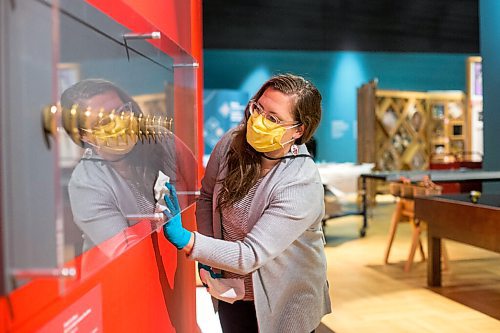 MIKAELA MACKENZIE / WINNIPEG FREE PRESS

Conservation technician Stephanie Chipilski dusts the plexiglass on Elisabith Ida Mulyani's piece, Oleh-oleh (Souvenir), in the new Artivism exhibit at the Canadian Museum for Human Rights in Winnipeg on Thursday, April 1, 2021. This installation is made up of 13 gold ears, commemorating 13 activists kidnapped for speaking out against the Indonesian dictatorial regime (where, in a purge of alleged communists, perpetrators kept victims' ears as souvenirs of the killings). Standup.

Winnipeg Free Press 2021