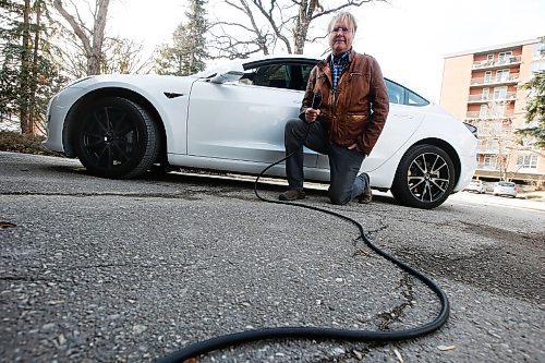 JOHN WOODS / WINNIPEG FREE PRESS
Peter Holle, whose family owns a Tesla, is photographed outside his home in Winnipeg Thursday, April 1, 2021. Holle said his family didnt need to be convinced to buy the electric vehicle by a government incentive and believes its value and cheap energy costs alone are enough to attract buyers. He said Coun. Kevin Kleins proposal to offer free parking for electric vehicles could trigger interest for lower priced green vehicles, though hes not sure if that would convince folks to actually buy them.

Reporter: Pursaga