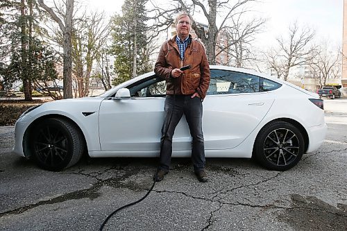 JOHN WOODS / WINNIPEG FREE PRESS
Peter Holle, whose family owns a Tesla, is photographed outside his home in Winnipeg Thursday, April 1, 2021. Holle said his family didnt need to be convinced to buy the electric vehicle by a government incentive and believes its value and cheap energy costs alone are enough to attract buyers. He said Coun. Kevin Kleins proposal to offer free parking for electric vehicles could trigger interest for lower priced green vehicles, though hes not sure if that would convince folks to actually buy them.

Reporter: Pursaga