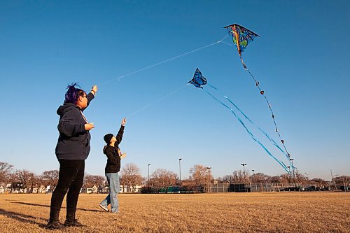 Daniel Crump / Winnipeg Free Press. Sisters Baby Sanderson (left) and Carly Sanderson (right) fly kites on a sunny evening at Sargent Park in Winnipegs West End. April 2, 2021.