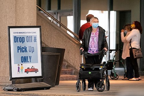 Daniel Crump / Winnipeg Free Press. A person waits to be picked up after getting their COVID-19 vaccination at the RBC Convention Centre. April 3, 2021.