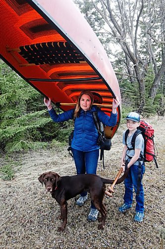 JOHN WOODS / WINNIPEG FREE PRESS
Megan Maxwell and her son Holden, 10, with their dog Tesla, prepare their camping gear for the upcoming season at their home near Birds Hill Park Monday, April 5, 2021. Maxwell was kicked out of the provincial camping site booking website after waiting for hours in line.

Reporter: McIntosh