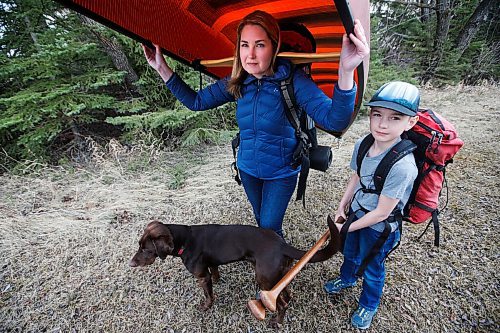 JOHN WOODS / WINNIPEG FREE PRESS
Megan Maxwell and her son Holden, 10, with their dog Tesla, prepare their camping gear for the upcoming season at their home near Birds Hill Park Monday, April 5, 2021. Maxwell was kicked out of the provincial camping site booking website after waiting for hours in line.

Reporter: McIntosh
