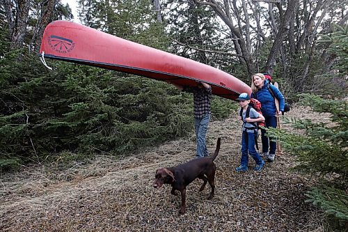JOHN WOODS / WINNIPEG FREE PRESS
Megan and Brent Maxwell and their son Holden, 10, and their dog Tesla, prepare their camping gear for the upcoming season at their home near Birds Hill Park Monday, April 5, 2021. Maxwell was kicked out of the provincial camping site booking website after waiting for hours in line.

Reporter: McIntosh
