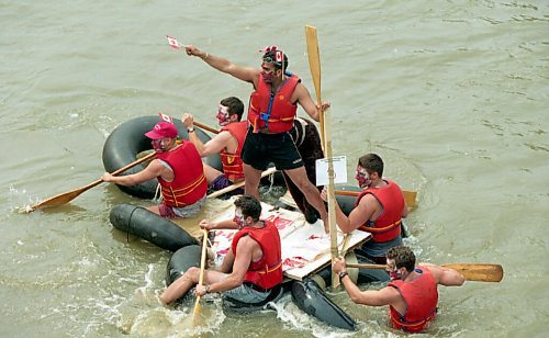 KEN GIGLIOTTI / WINNIPEG FREE PRESS
July 1 - 1995

Sal Loxley (standing) inspires his weary but willing troops to paddle yesterday during the Osborne Village Canada Day Raft Race on the Assiniboine River between the Maryland and Osborne bridges.