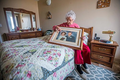 MIKAELA MACKENZIE / WINNIPEG FREE PRESS

Ruth Schroeder poses for a portrait with a wedding photo at her home in Morris on Thursday, April 8, 2021. John and Ruth Schroeder have been married for 76 years. For Jen Zoratti story.

Winnipeg Free Press 2021