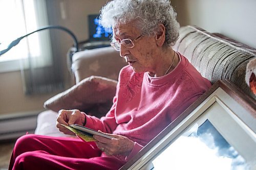 MIKAELA MACKENZIE / WINNIPEG FREE PRESS

Ruth Schroeder looks through family photos at her home in Morris on Thursday, April 8, 2021. John and Ruth Schroeder have been married for 76 years. For Jen Zoratti story.

Winnipeg Free Press 2021