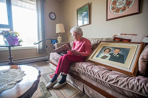 MIKAELA MACKENZIE / WINNIPEG FREE PRESS

Ruth Schroeder looks through family photos at her home in Morris on Thursday, April 8, 2021. John and Ruth Schroeder have been married for 76 years. For Jen Zoratti story.

Winnipeg Free Press 2021