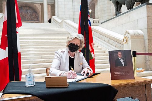 MIKE SUDOMA / WINNIPEG FREE PRESS  Lieutenant Governor of Manitoba, Janice Filmon, signs a book of condolences for the late Prince Philip at the Manitoba Legislative Building Friday morning
April 9, 2021