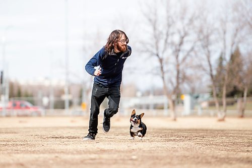 MIKE SUDOMA / WINNIPEG FREE PRESS  
Trevor Hale and his 5 month old pup, Luna, go for a run at the Dog Park on Grant and Moray Friday afternoon
April 9, 2021