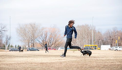 MIKE SUDOMA / WINNIPEG FREE PRESS  
Trevor Hale and his 5 month old pup, Luna, go for a run at the Dog Park on Grant and Moray Friday afternoon
April 9, 2021