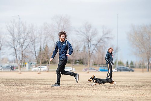 MIKE SUDOMA / WINNIPEG FREE PRESS  
Trevor Hale and his 5 month old pup, Luna, go for a run at the Dog Park on Grant and Moray Friday afternoon
April 9, 2021