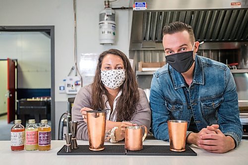 MIKAELA MACKENZIE / WINNIPEG FREE PRESS


Shane Masters and Marie-Pier Racine, owners of Angel's Share Cocktail Co., pose for a portrait in their commercial kitchen in Winnipeg on Friday, April 9, 2021. Angel's Share Cocktail Co. is a year-old biz that turns out alcohol-free cocktail mixes, where you add the alcohol at home. For Dave Sanderson story.
Winnipeg Free Press 2020.