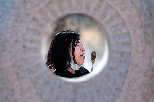 Daniel Crump / Winnipeg Free Press. Shy-Anne Nasecapow is seen singing and drumming through a whole in the monument to missing and murdered indigenous women and girls near the Odena circle at the Forks. Nasecapow performed during a gathering organized by a group called MMIWG2S Takes Back Canada which is holding rallies across Canada every Saturday to bring attention the murdered and missing indigenous people. April 10, 2021.