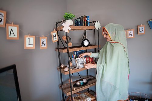 Daniel Crump / Winnipeg Free Press. Asra Waleed adjusts the ramadan corner her and her family setup in their home. April 10, 2021.