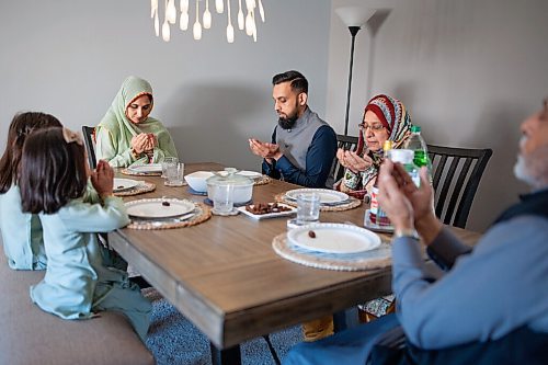 Daniel Crump / Winnipeg Free Press. Waleeds family demonstrate the aftar prayer, which is said as the family prepares to break their ramadan fast. April 10, 2021.