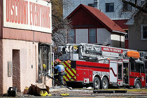 JOHN WOODS / WINNIPEG FREE PRESS
Firefighters work to extinguish a fire at Discount Everything on Ellice Avenue in Winnipeg Sunday, April 11, 2021. 

Reporter: ?