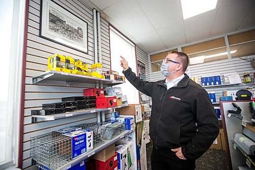 MIKAELA MACKENZIE / WINNIPEG FREE PRESS
Lincoln Poulin, president of Poulin's Pest Control, points towards a picture of his grandfather with a pile of ten thousand rats at the store in Winnipeg on Thursday, April 15, 2021. For Dave Sanderson story.
Winnipeg Free Press 2020.