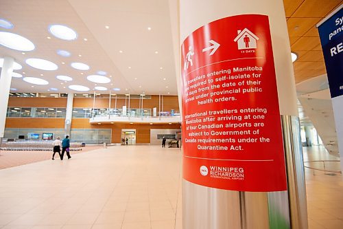 MIKE SUDOMA / WINNIPEG FREE PRESS
Signage instructing travellers to self isolate after entering Manitoba can be found on pillars in the arrival terminal of the Winnipeg James Armstrong Richardson International Airport Friday.
April 16, 2021