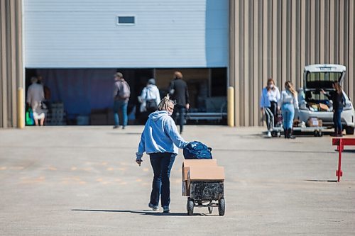 MIKAELA MACKENZIE / WINNIPEG FREE PRESS

Vendors set up for the Third+Bird spring market at the Red River Exhibition in Winnipeg on Friday, April 16, 2021. For Temur Durrani story.
Winnipeg Free Press 2020.