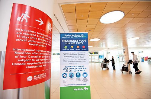 MIKE SUDOMA / WINNIPEG FREE PRESS  
Attendees of Air Canada, flight AC8618, walk past signage indicating quarantine/isolation as well as Covid 19 practices for travellers entering Manitoba after arriving in Winnipeg from Vancouver, BC. Friday afternoon.
April 9, 2021