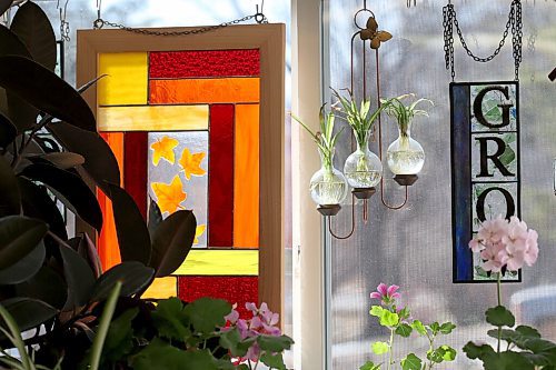 SHANNON VANRAES / WINNIPEG FREE PRESS Glass art hangs in the window of Heather Dawson's backyard studio in Teulon on April 17, 2021.