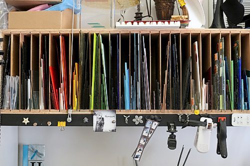 SHANNON VANRAES / WINNIPEG FREE PRESS Glass sheets are carefully stored and organized by colour at Heather Dawson's backyard studio in Teulon.