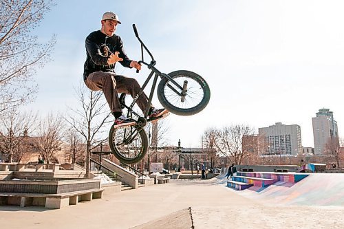 Daniel Crump / Winnipeg Free Press. Brandon Sawchyn does a trick on his BMX bike at the skatepark at the Fork on Saturday afternoon. April 17, 2021.