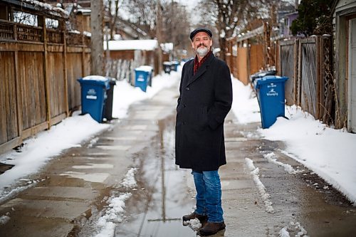 MIKE DEAL / WINNIPEG FREE PRESS
Writes of Spring poet, James Scoles, in a back alley in Wolseley where he goes on daily walks. The less traveled alleys have been a more peaceful route for his for his exercise during the pandemic. 
James Scoles is the author of The Trailer (Signature Editions). He teaches creative writing and literature at the University of Winnipeg.
210415 - Thursday, April 15, 2021.