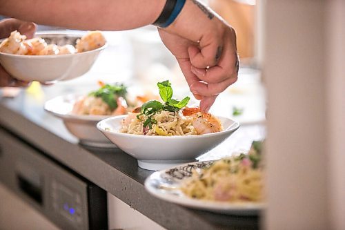 MIKAELA MACKENZIE / WINNIPEG FREE PRESS

Ashley Hebel, head chef at Frenchway Cafe on Corydon, makes Pasta Aglio et olio with Gamberi in Winnipeg on Monday, April 19, 2021. For Eva Wasney story.
Winnipeg Free Press 2020.