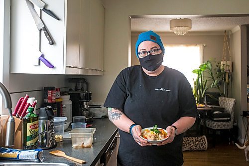 MIKAELA MACKENZIE / WINNIPEG FREE PRESS

Ashley Hebel, head chef at Frenchway Cafe on Corydon, poses for a portrait with a bowl of Pasta Aglio et olio with Gamberi in Winnipeg on Monday, April 19, 2021. For Eva Wasney story.
Winnipeg Free Press 2020.