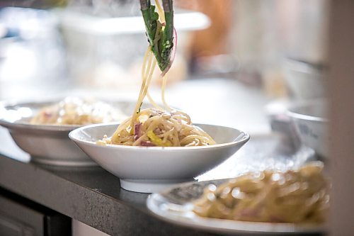 MIKAELA MACKENZIE / WINNIPEG FREE PRESS

Ashley Hebel, head chef at Frenchway Cafe on Corydon, makes Pasta Aglio et olio with Gamberi in Winnipeg on Monday, April 19, 2021. For Eva Wasney story.
Winnipeg Free Press 2020.