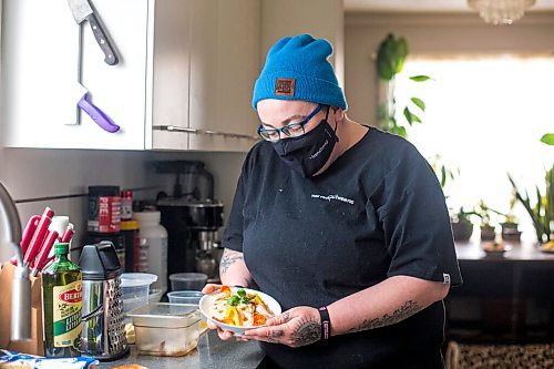 MIKAELA MACKENZIE / WINNIPEG FREE PRESS

Ashley Hebel, head chef at Frenchway Cafe on Corydon, poses for a portrait with a bowl of Pasta Aglio et olio with Gamberi in Winnipeg on Monday, April 19, 2021. For Eva Wasney story.
Winnipeg Free Press 2020.