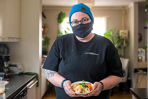 MIKAELA MACKENZIE / WINNIPEG FREE PRESS

Ashley Hebel, head chef at Frenchway Cafe on Corydon, poses for a portrait with a bowl of Pasta Aglio et olio with Gamberi in Winnipeg on Monday, April 19, 2021. For Eva Wasney story.
Winnipeg Free Press 2020.