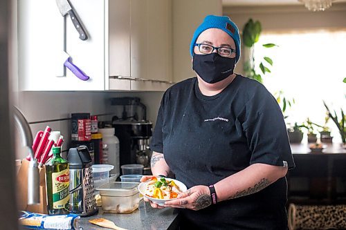 MIKAELA MACKENZIE / WINNIPEG FREE PRESS

Ashley Hebel, head chef at Frenchway Cafe on Corydon, poses for a portrait with a bowl of Pasta Aglio et olio with Gamberi in Winnipeg on Monday, April 19, 2021. For Eva Wasney story.
Winnipeg Free Press 2020.