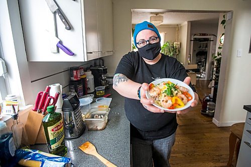 MIKAELA MACKENZIE / WINNIPEG FREE PRESS

Ashley Hebel, head chef at Frenchway Cafe on Corydon, poses for a portrait with a bowl of Pasta Aglio et olio with Gamberi in Winnipeg on Monday, April 19, 2021. For Eva Wasney story.
Winnipeg Free Press 2020.