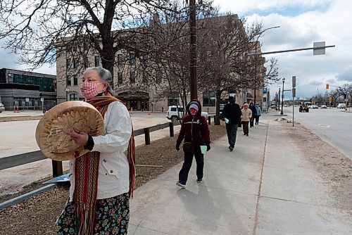 JESSE BOILY  / WINNIPEG FREE PRESS
A group of about 10 walked is lead by Cheryl-Anne Carr at the prayer walk for the people of Myanmar outside the Upper Fort Gary gates to the Human Rights Museum on Tuesday. Participants hung a thousand origami cranes in a tree as a symbol of hope for the people of Myanmar. Tuesday, April 20, 2021.
Reporter: Standup