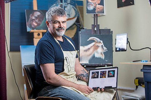 MIKAELA MACKENZIE / WINNIPEG FREE PRESS

JD Hawk, one local artist who has dipped his art in the waters of the burgeoning NFT art space, poses for a portrait at his home studio area in Winnipeg on Tuesday, April 20, 2021. For Joel Schlesinger story.
Winnipeg Free Press 2020.