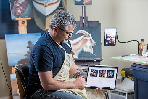 MIKAELA MACKENZIE / WINNIPEG FREE PRESS

JD Hawk, one local artist who has dipped his art in the waters of the burgeoning NFT art space, poses for a portrait at his home studio area in Winnipeg on Tuesday, April 20, 2021. For Joel Schlesinger story.
Winnipeg Free Press 2020.