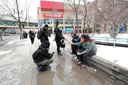 RUTH BONNEVILLE / WINNIPEG FREE PRESS 

LOCAL -  DCSP tour with them. 

Photo of DCSP worker, Jasmine Kodi (crouching), Vinnie Lillie and Sean Sousa giving info to people to connect them to services  who may need them in the downtown area. 

Story: The Downtown Community Safety Partnership is a relatively new outreach organization that holds patrols in the downtown area. 

Reporter and photog go for walk with some volunteers and capture a snapshot of their work in and around their head office at the Air Canada building on Portage Ave. 

Also, interview with DCSP director, Greg Burnett and with some social workers.  

Malak Abas
Reporter | Winnipeg Free Press

April 15,  2021