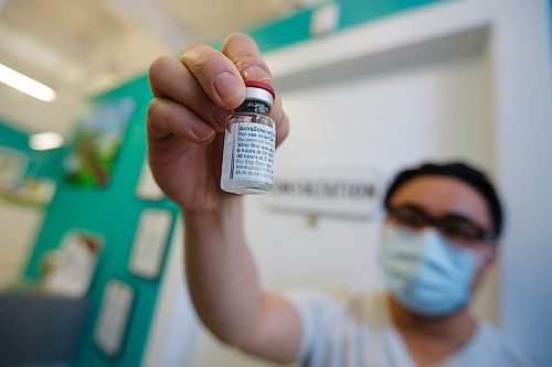 JOHN WOODS / WINNIPEG FREE PRESS
Ryan Chan, executive director of Exchange District Pharmacy, is photographed with a vial of AstraZeneca COVID-19 vaccine at his pharmacy in Winnipeg Tuesday, April 20, 2021. 

Reporter: Rollason