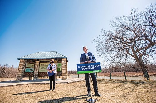 MIKAELA MACKENZIE / WINNIPEG FREE PRESS

Premier Brian Pallister (right) and minister of conservation and climate, Sarah Guillemard, speak to the media about investments in provincial parks at Beaudry Provincial Park on Thursday, April 22, 2021. For Sarah story.
Winnipeg Free Press 2020.