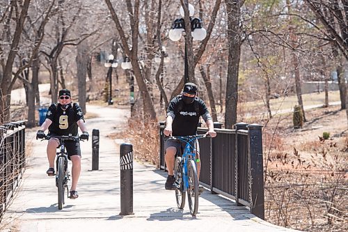 MIKE SUDOMA / WINNIPEG FREE PRESS  
Cyclists (left to right) Steve and Jason, take a ride through the water front bike path Friday afternoon
April 22, 2021