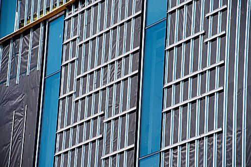 MIKE SUDOMA / WINNIPEG FREE PRESS  
Installation of 400 solar energy - conducting Kromatix Building Integrated Photovoltaics to the exterior of Red River Colleges new Innovation Centre next week.
April 22, 2021