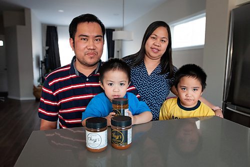 Daniel Crump / Winnipeg Free Press. (L to R) Roy and Sarah Belesario with their two kids Russel (2yo) and Riley (5yo).The two met seven years ago, after moving to Winnipeg separately from the Philippines, and began making Sarahs grandmothers recipe because they didnt like any of the commercially available brands on the market. April 22, 2021.