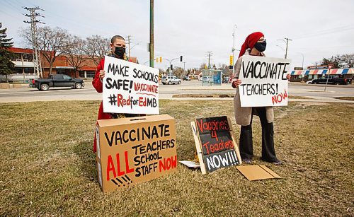 MIKE DEAL / WINNIPEG FREE PRESS
Etty Dallmann (left) and Kara Godin (right) hold signs they made during a protest outside Glenlawn Collegiate Friday afternoon. They are asking the province to immediately vaccinate teachers and school staff throughout Manitoba. 
Concerned community members will hold protests demanding vaccines be made available to all teachers and school staff in all regions of Manitoba over the next three weeks to ensure the school system is made safe for the return of students in the fall.
See Katlyn Streilein story
210423 - Friday, April 23, 2021.